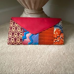Ethnic deep red floral and geometric print clutch